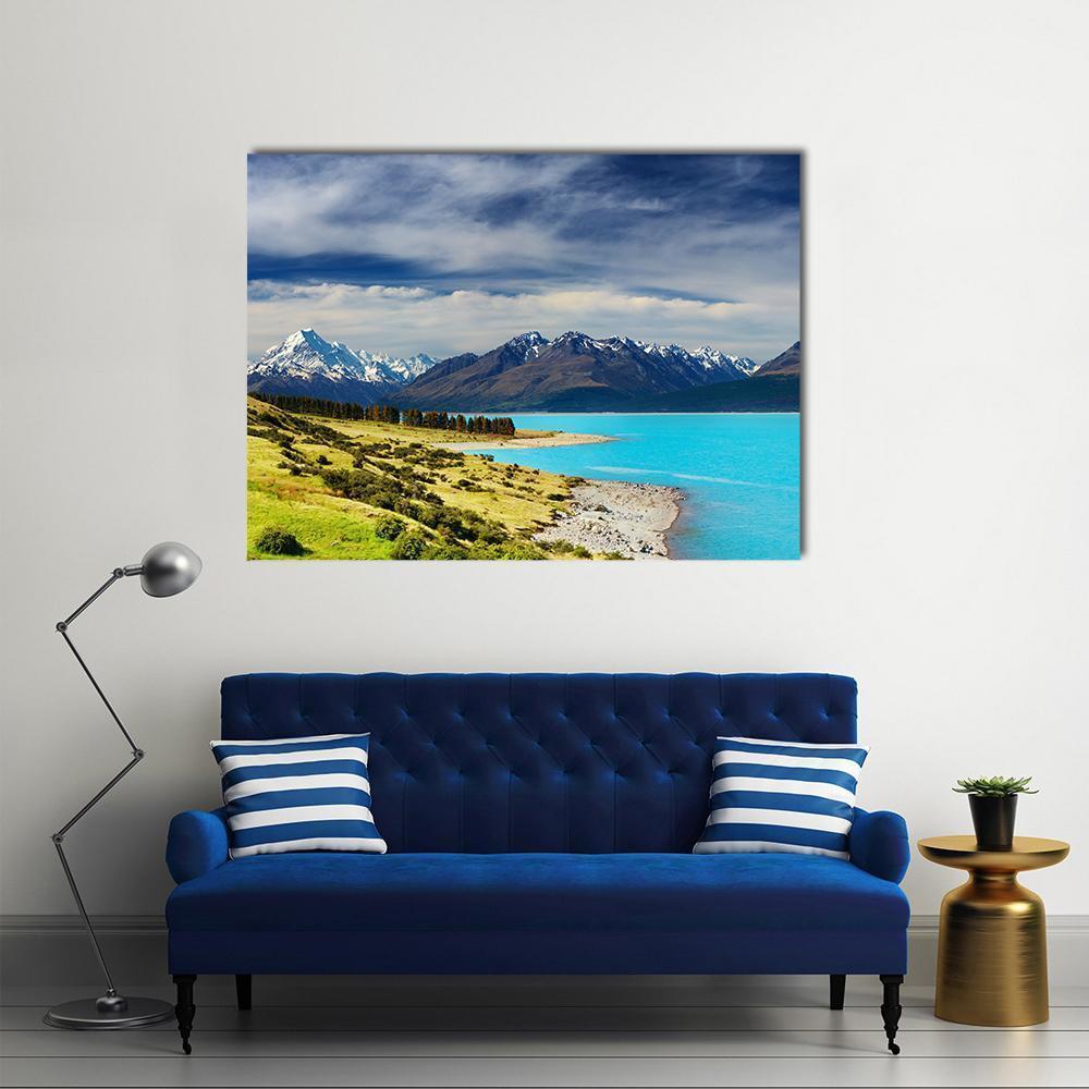 Mount Cook and Pukaki Lake Canvas Wall Art in white, green and blue, single panel hung on a wall