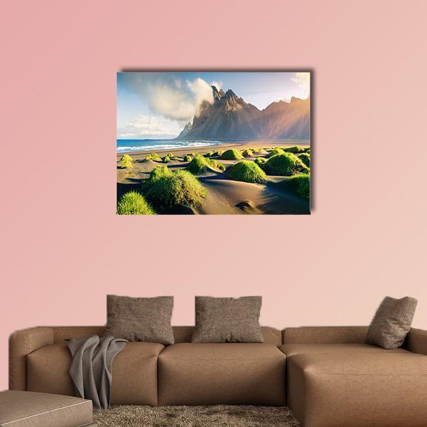 Green Dunes Toward Rugged Mountain Peaks Canvas Wall Art in brown, green and blue, single panel hung on a wall