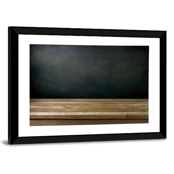 Wooden Table Against Grunge Black Canvas Wall Art