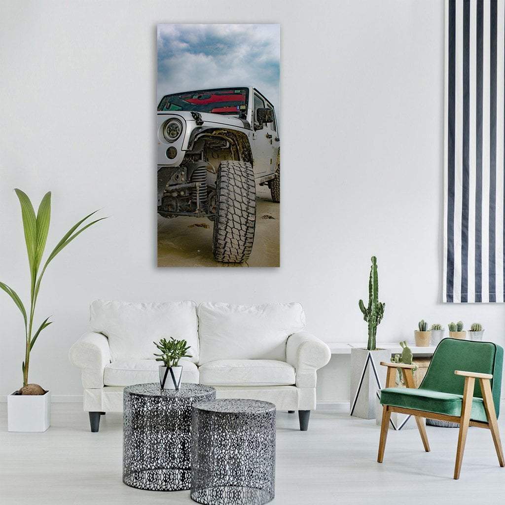 White 4x4 Jeep Front Tire Vertical Canvas Wall Art in white, gray and blue, single vertical panel hung on a wall