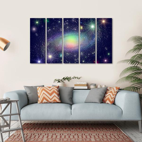Spiral Galaxy Surrounded by Stars Canvas Wall Art in black, blue and multicolor, single panel hung on a wall