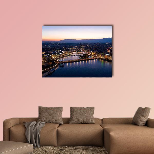 Geneva Night Aerial View Canvas Wall Art in black, orange and blue, single panel hung on a wall
