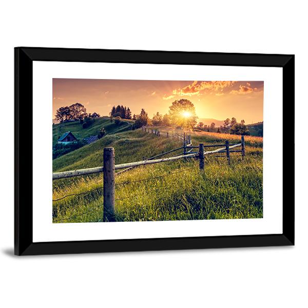 Sunset Farmhouse with Wooden Fence Canvas Wall Art in orange, yellow and green, framed print, product view on a white background