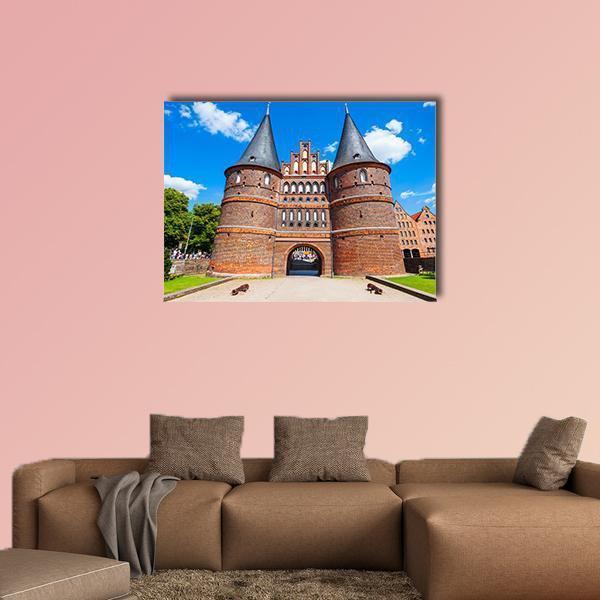 Holstentor Gate, Lübeck Canvas Wall Art in brown, red and blue, single panel hung on a wall