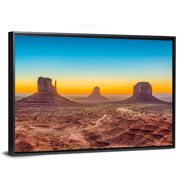 Monument Valley at Dawn Canvas Wall Art in brown, orange and blue, framed canvas, product view on a white background