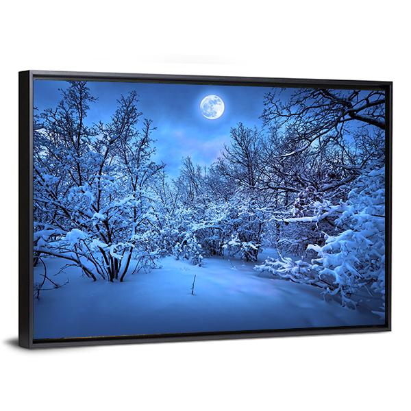 Moonlit Path Through Snowy Forest Canvas Wall Art in white and blue, framed canvas, product view on a white background