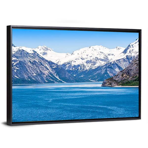 Snow-capped Mountains Over Calm Blue Water Canvas Wall Art in white, gray and blue, framed canvas, product view on a white background