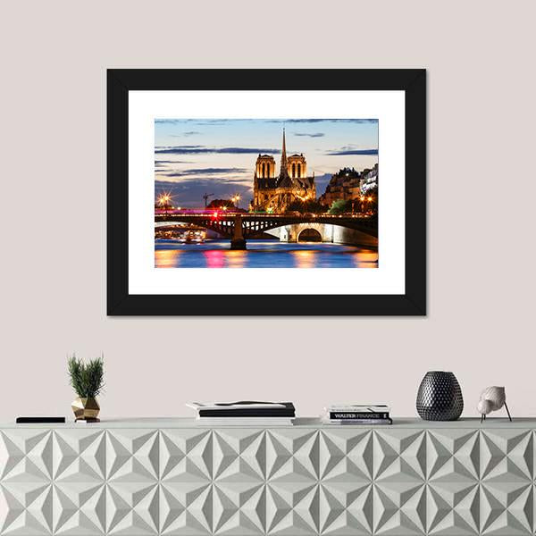 Notre Dame Cathedral Paris at Dusk Canvas Wall Art in gold, orange and blue, single panel hung on a wall