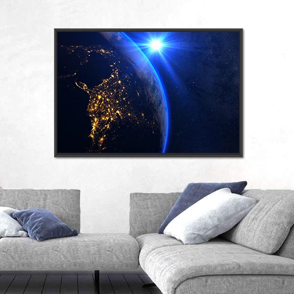 Rising Blue Sun on Planet Earth Canvas Wall Art in black, gold and blue, framed canvas, product view on a white background