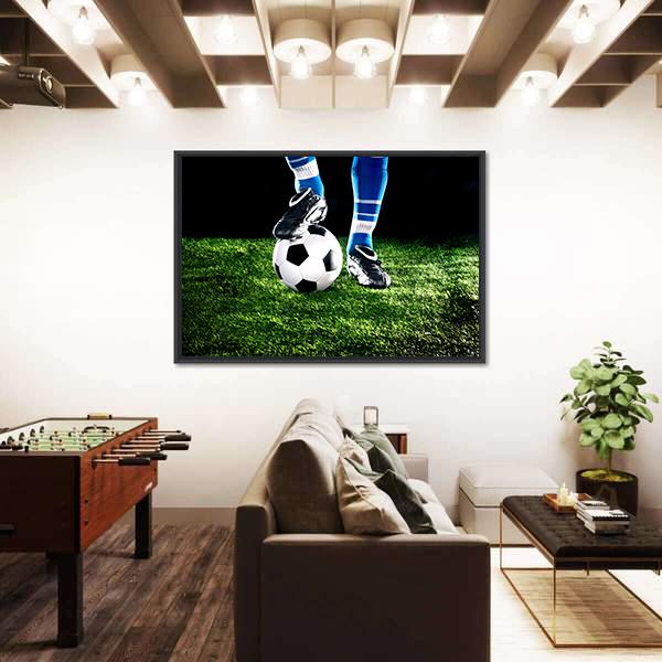 Cleat Resting on Soccer Ball Canvas Wall Art in black, green and blue, framed canvas, product view on a white background