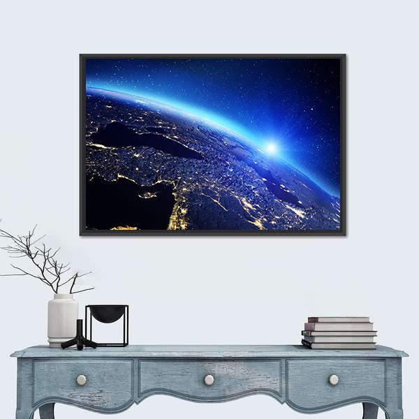 Sunrise Over Earth with City Lights Canvas Wall Art in black, blue and navy, framed canvas, product view on a white background