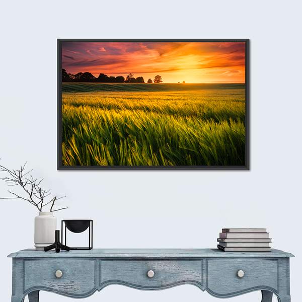 Sunset Over a Wheat Field Canvas Wall Art in orange, yellow and green, framed canvas, product view on a white background