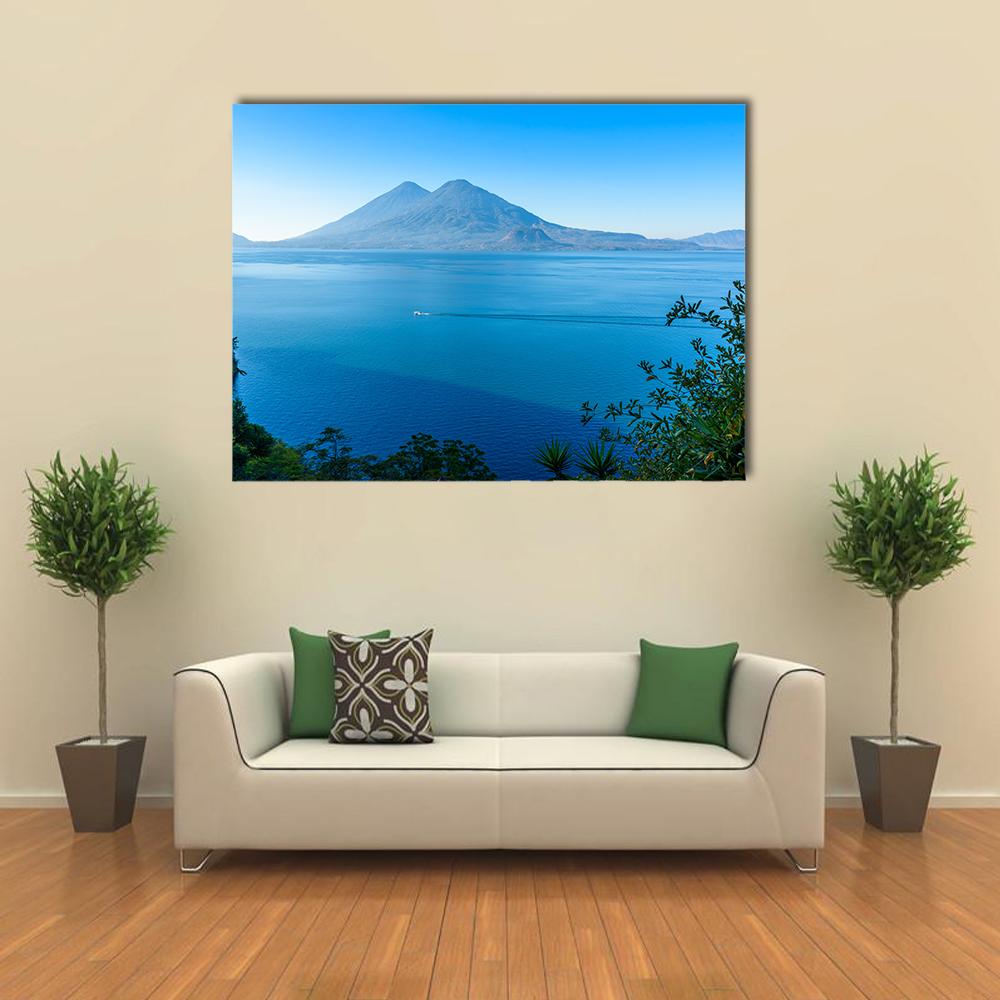 Lake Atitlan Volcano View with Boat Canvas Wall Art in green and blue, single panel hung on a wall
