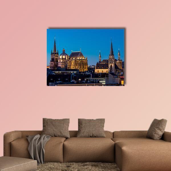Aachen Cathedral at Night Canvas Wall Art in black, gold and blue, single panel hung on a wall