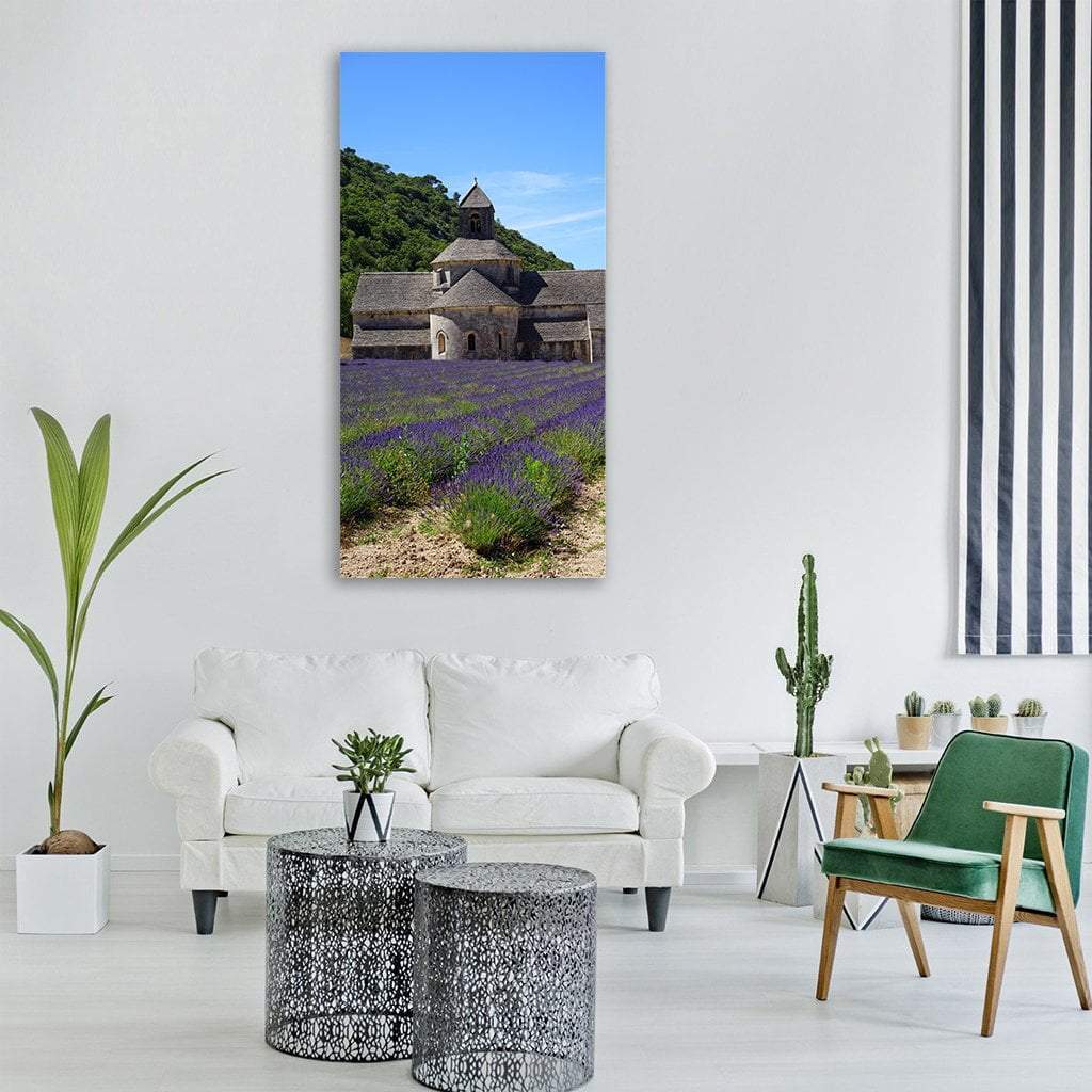 Sénanque Abbey in Lavender Fields Vertical Canvas Wall Art in green, blue and purple, single vertical panel hung on a wall