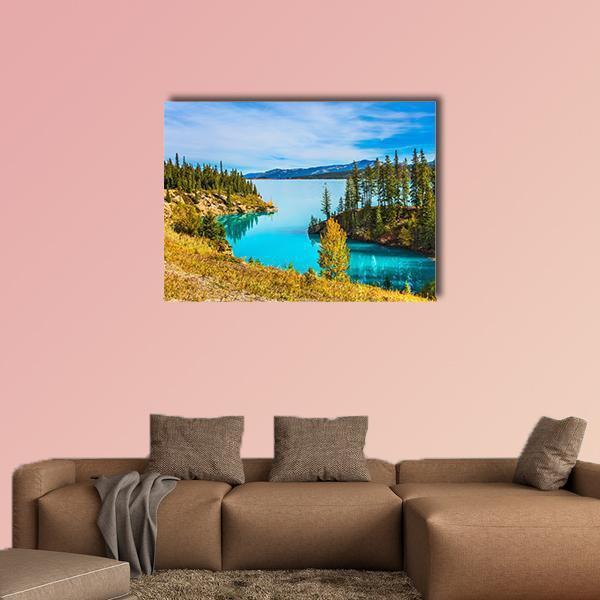 Abraham Lake Turquoise Shore Canvas Wall Art in yellow, green and blue, single panel hung on a wall