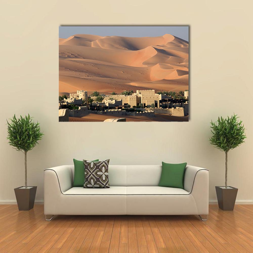 Abu Dhabi Desert Oasis with Fortified Buildings Canvas Wall Art in beige, brown and orange, single panel hung on a wall
