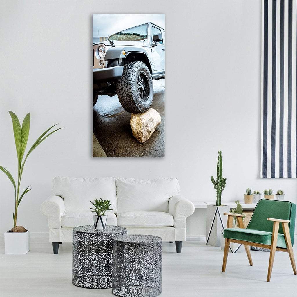 Adventure Jeep on Boulder Vertical Canvas Wall Art in black, white and gray, single vertical panel hung on a wall