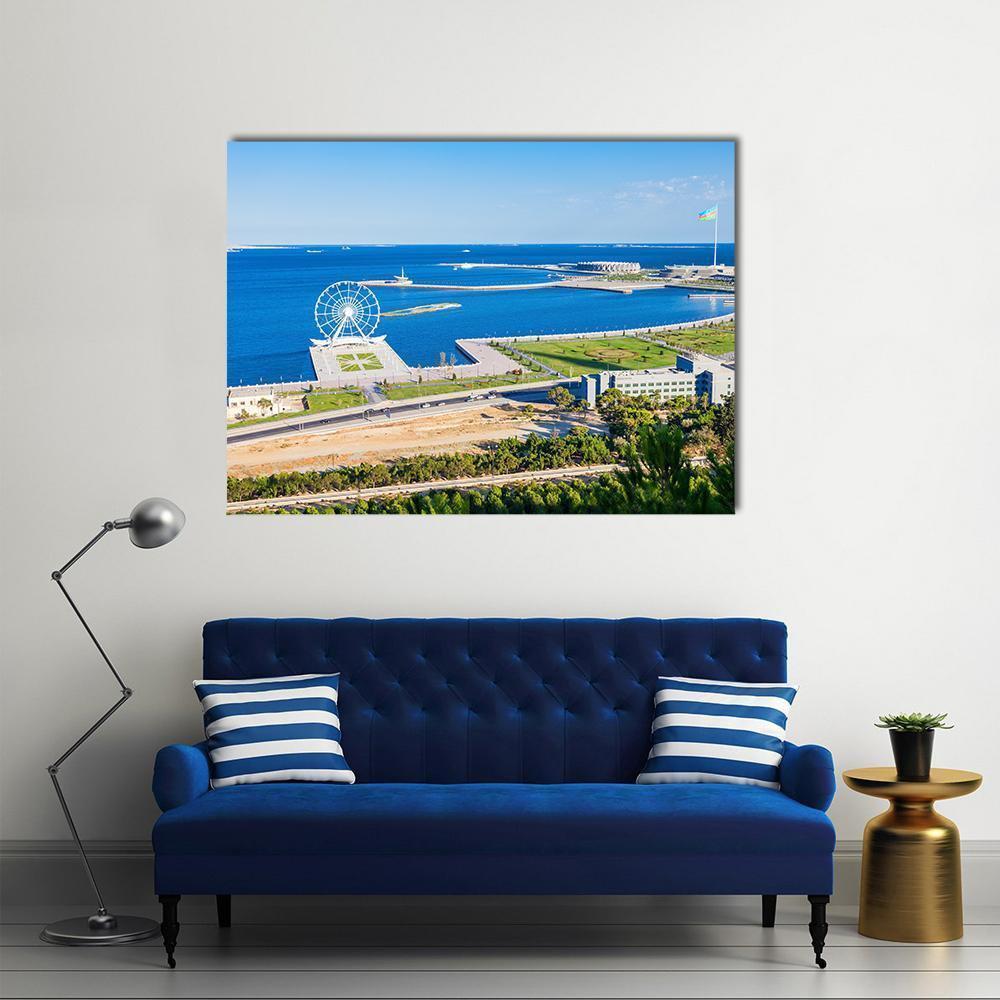 Aerial Coastal Ferris Wheel and Park Canvas Wall Art in white, green and blue, single panel hung on a wall