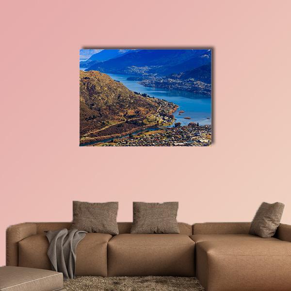 Aerial View of Frankton and Lake Wakatipu Canvas Wall Art in brown and blue, single panel hung on a wall