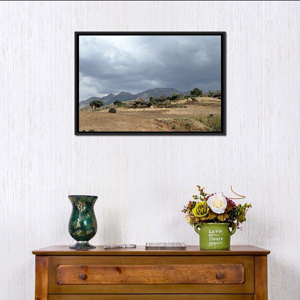 Thatched Huts in Rural Africa Canvas Wall Art in gray, beige and brown, framed canvas, product view on a white background