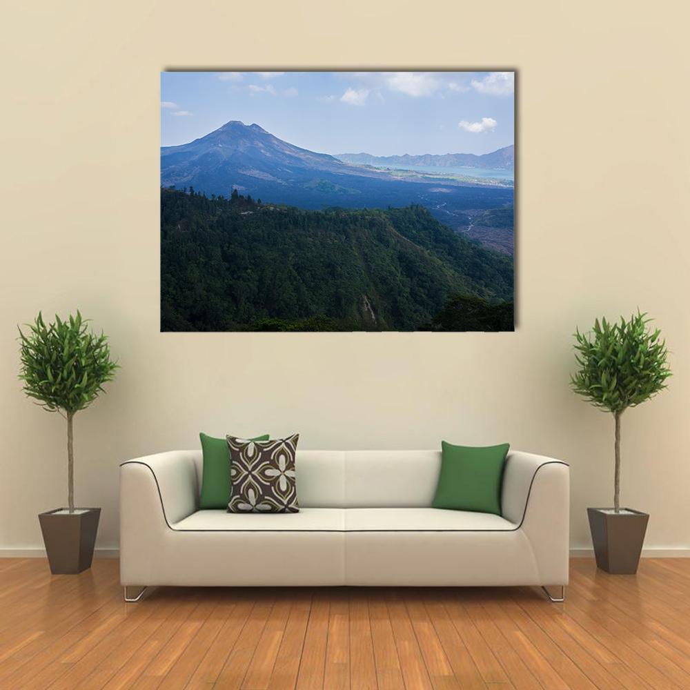 Agung Mountain with Lake and Forest Canvas Wall Art in green and blue, single panel hung on a wall