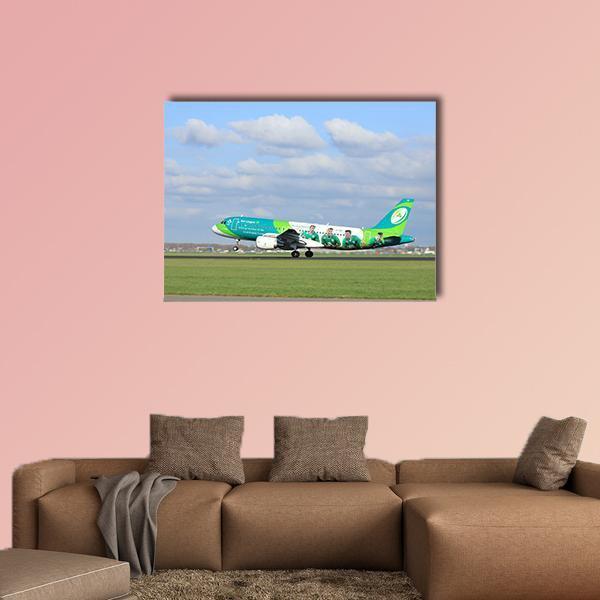 Airbus Landing on Runway Canvas Wall Art in white, green and blue, single panel hung on a wall