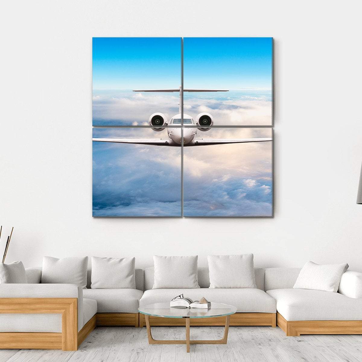 Private Jet in Flight Canvas Wall Art in white and blue, hung on a wall