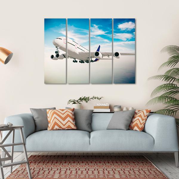 Airplane Against Blue Sky Canvas Wall Art-4 Horizontal-Gallery Wrap-34" x 24"-Tiaracle