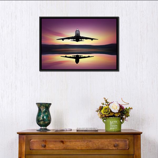 Airplane Flying Above Lake Canvas Wall Art in black, orange and purple, framed canvas, product view on a white background