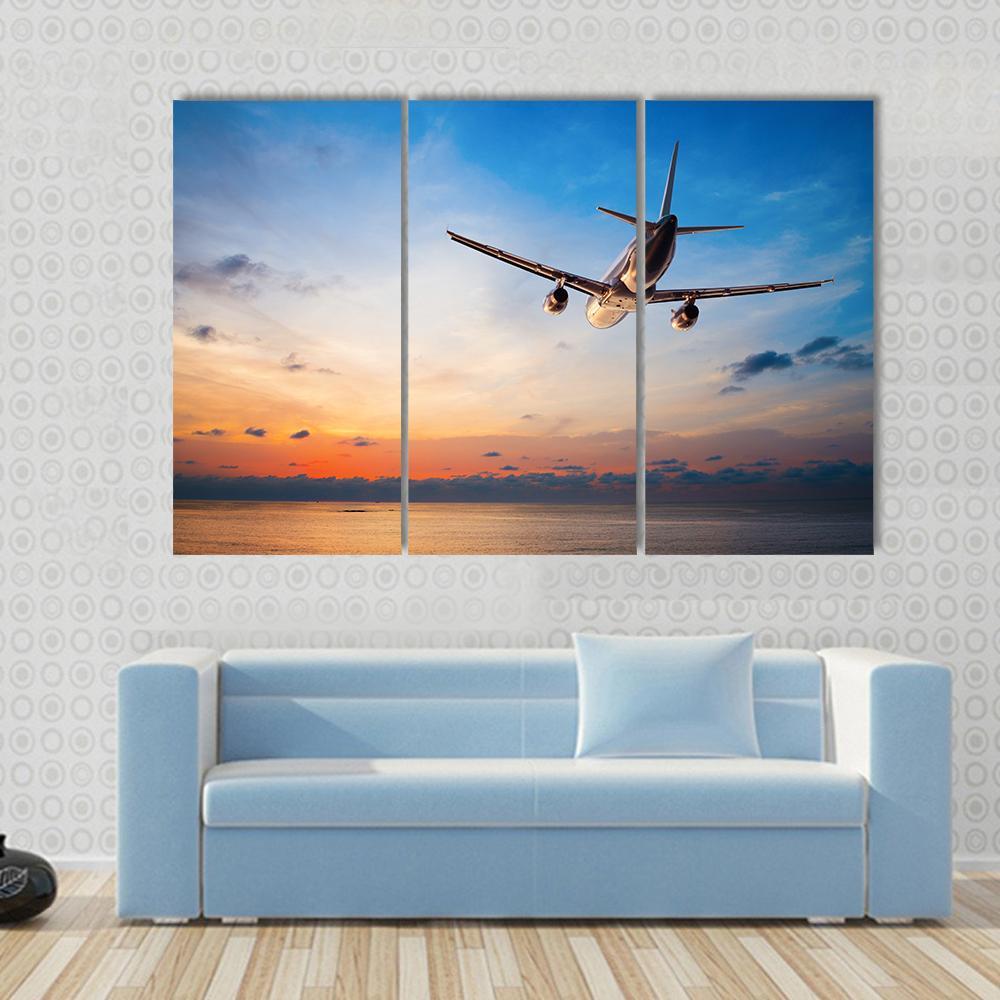 Airplane Flying Above Tropical Sea Canvas Wall Art-5 Star-Gallery Wrap-62" x 32"-Tiaracle