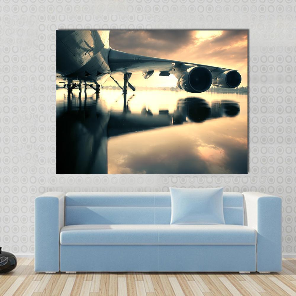 Airplane Over Water in Thailand Canvas Wall Art in gray, yellow and blue, single panel hung on a wall