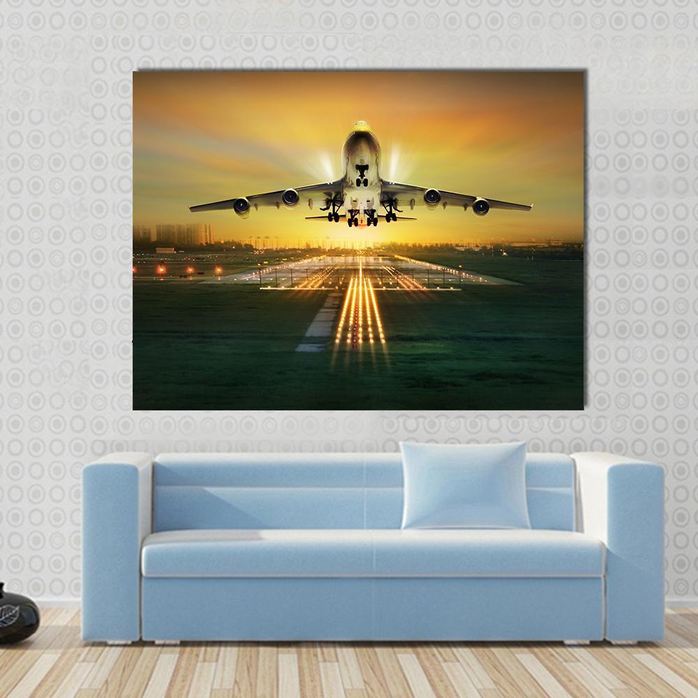 Airplane Taking Off from Runway Canvas Wall Art in black, orange and yellow, single panel hung on a wall