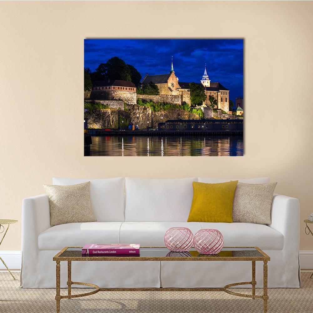 Akershus Fortress by Night Canvas Wall Art in black, gold and blue, single panel hung on a wall