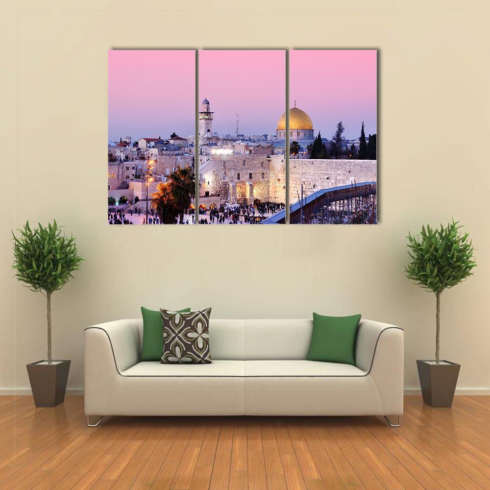 Al Aqsa Mosque at Dusk Canvas Wall Art in gold, purple and pink, 3 panel horizontal set hung on a wall