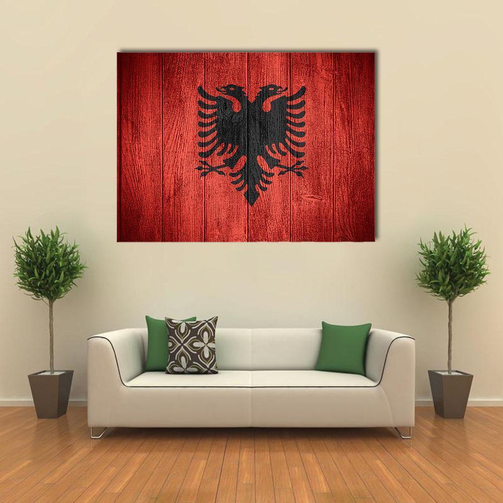 Albanian Flag on Wooden Planks Canvas Wall Art in black and red, single panel hung on a wall
