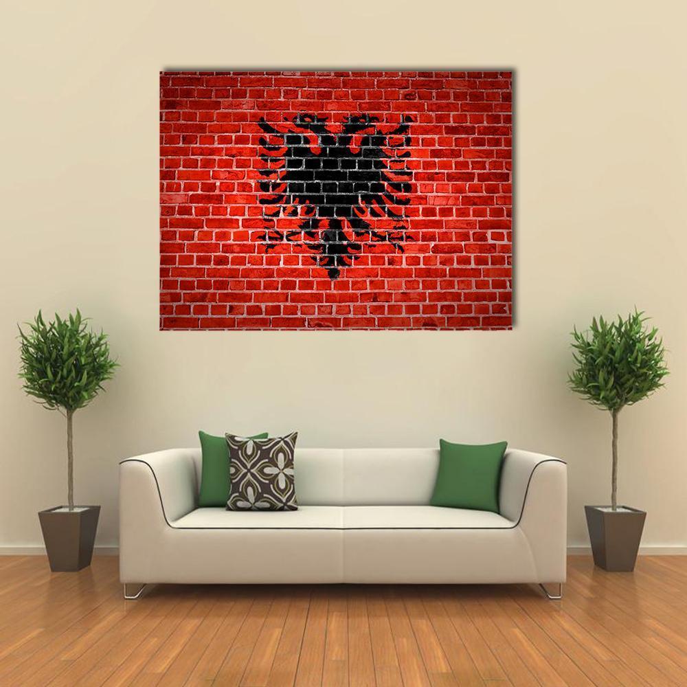 Albanian Flag on Brick Canvas Wall Art in black and red, single panel hung on a wall