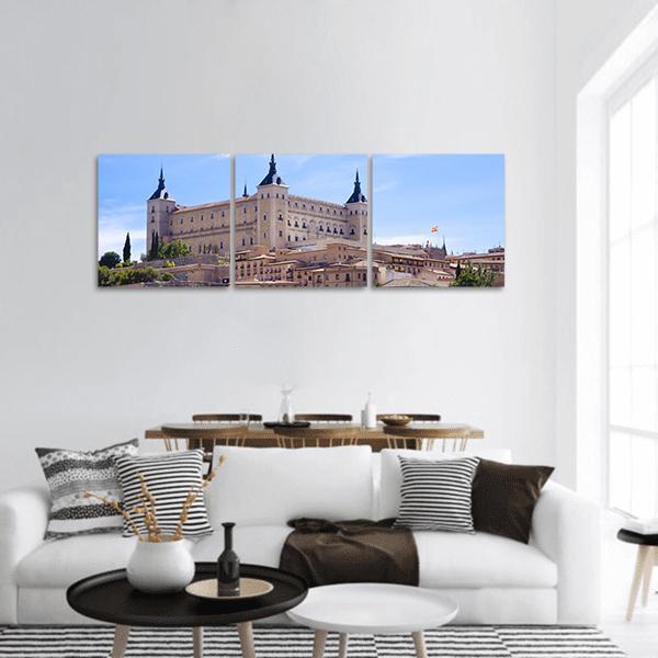 Alcázar of Toledo Cityscape Panoramic Canvas Wall Art in beige, brown and blue, hung on a wall