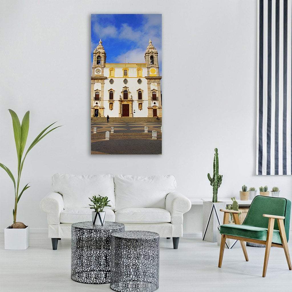 White Baroque Church with Twin Bell Towers Vertical Canvas Wall Art in white, beige and blue, single vertical panel hung on a wall