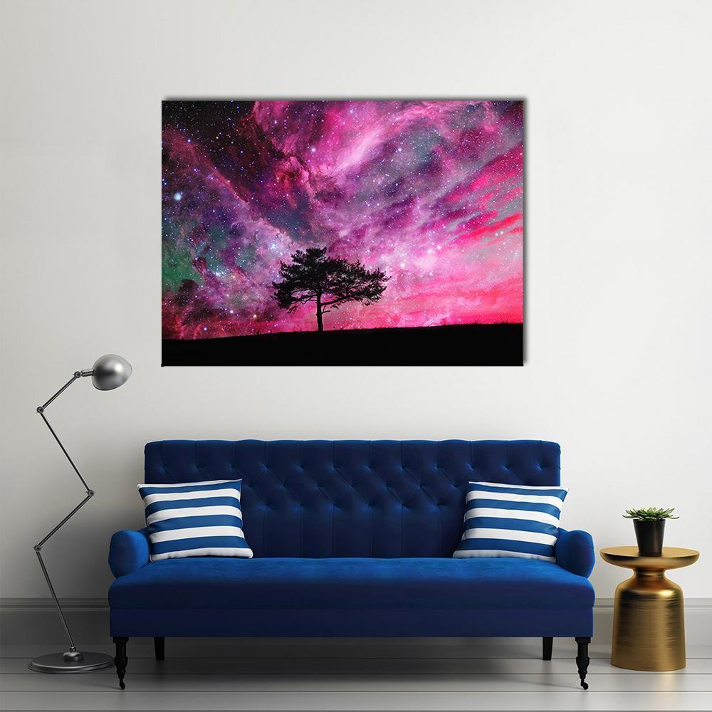 Alien Planet with Tree Silhouette Canvas Wall Art in black, purple and pink, single panel hung on a wall