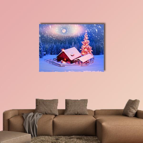 Snow-covered Cabin with Moonlit Christmas Tree Canvas Wall Art in white, blue and pink, single panel hung on a wall
