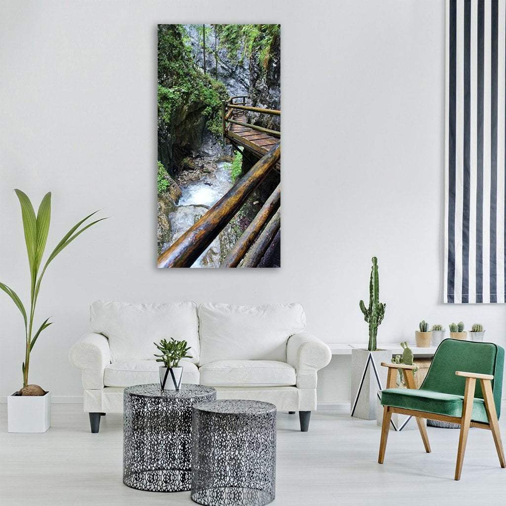 Wet Boardwalk in Austrian Alpine Gorge Vertical Canvas Wall Art in gray, brown and green, single vertical panel hung on a wall