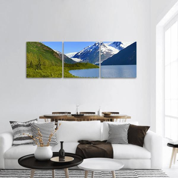 Alaska Mountain Lake View Panoramic Canvas Wall Art in white, green and blue, hung on a wall