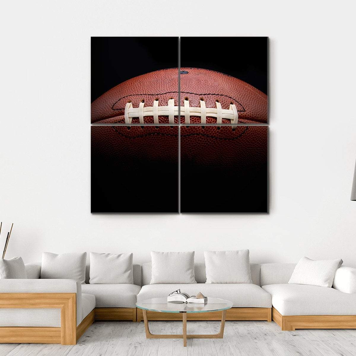 American Football Close-up with White Laces Canvas Wall Art in black and brown, hung on a wall