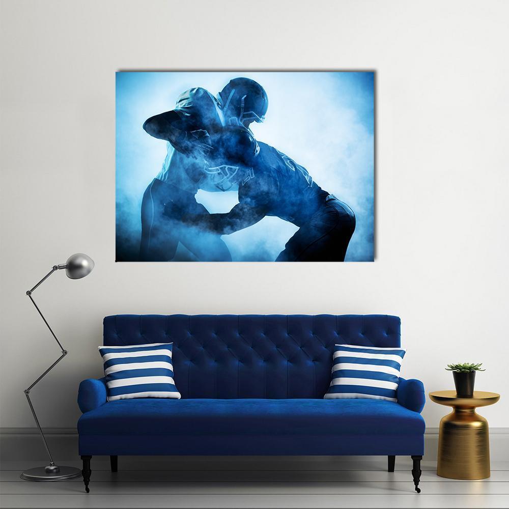 American Football Player Silhouettes Canvas Wall Art in black, white and blue, single panel hung on a wall