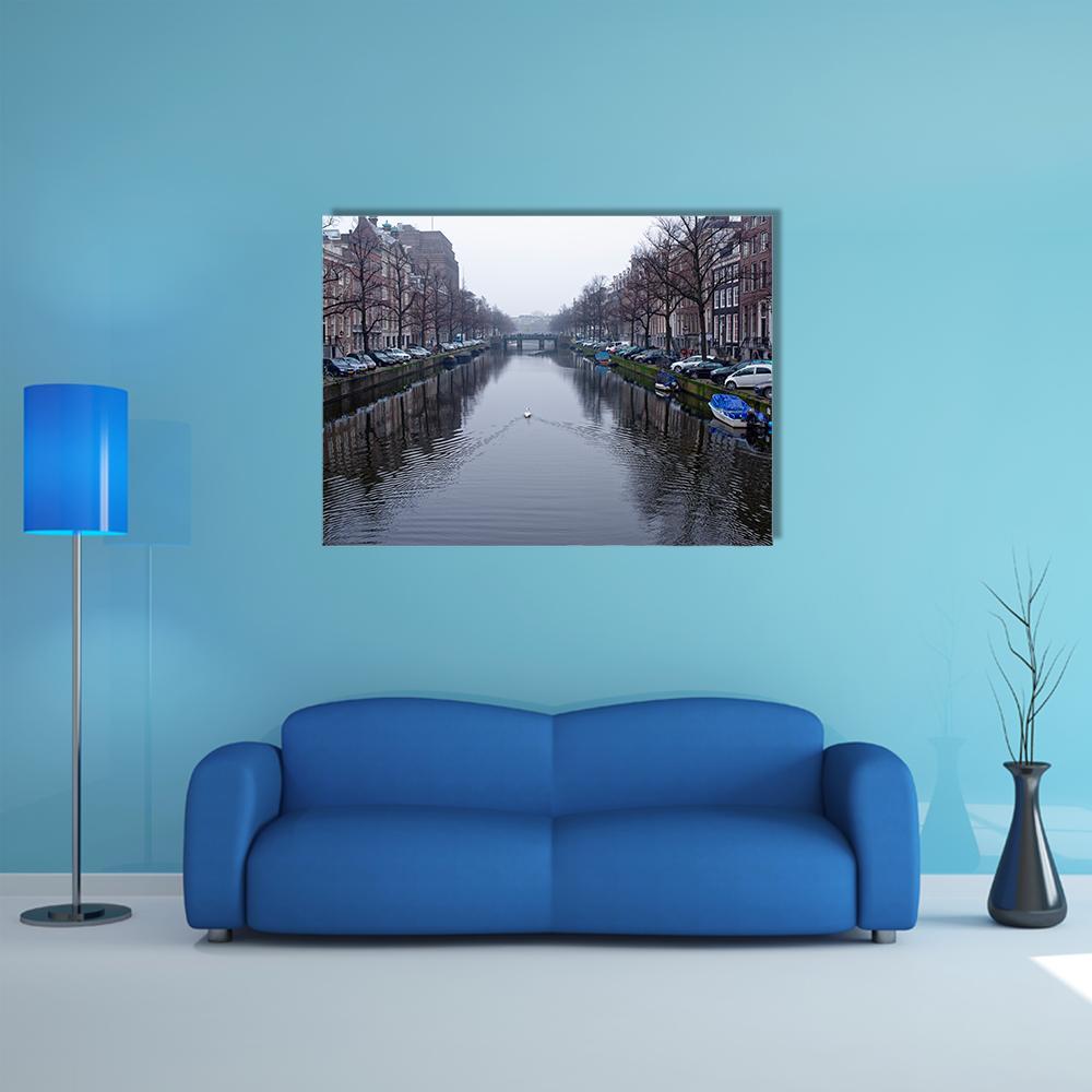 Amsterdam Canal with Swans and Boats Canvas Wall Art in gray, brown and blue, single panel hung on a wall