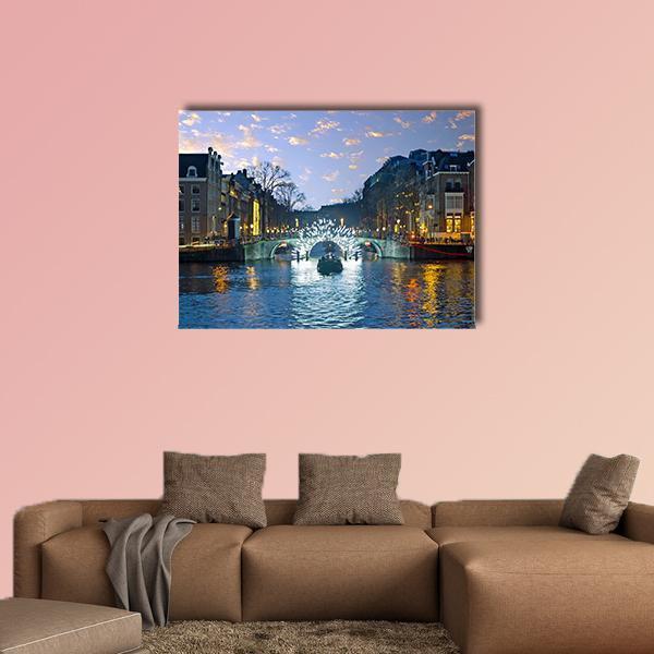 Amsterdam Canal Lights at Night Canvas Wall Art in black, yellow and blue, single panel hung on a wall