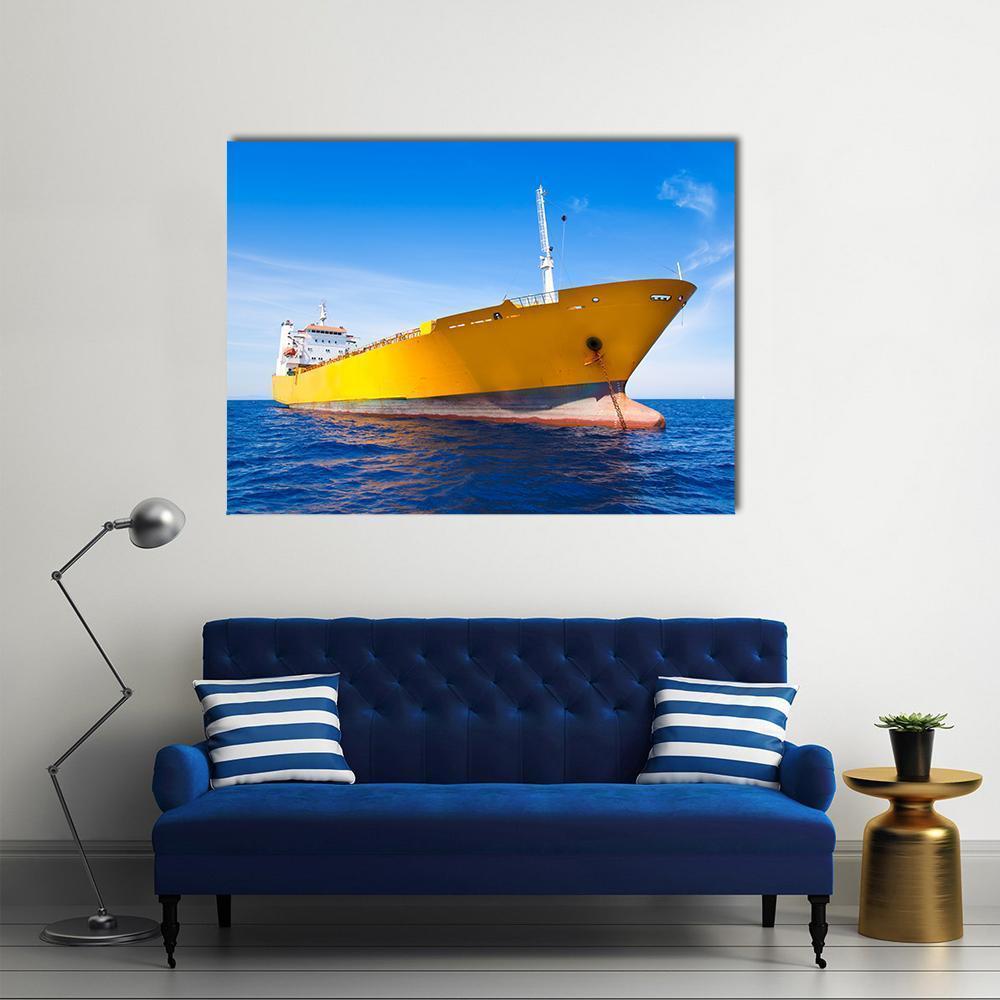 Yellow Cargo Ship Bow with Anchor Chain Canvas Wall Art in yellow and blue, single panel hung on a wall
