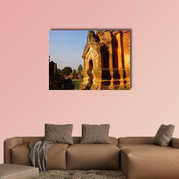 Buddhist Stupa in Myanmar Canvas Wall Art in brown, orange and blue, single panel hung on a wall