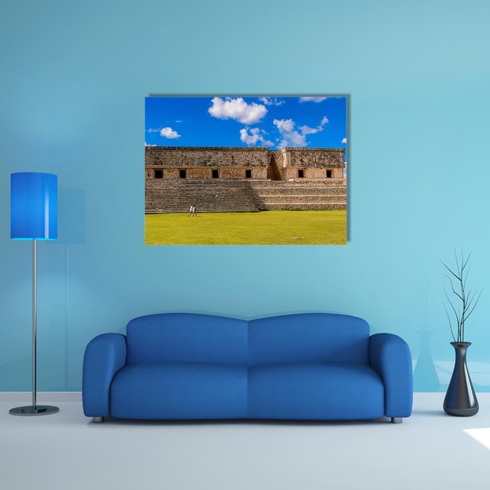 Ancient Maya City Canvas Wall Art in brown, green and blue, single panel hung on a wall